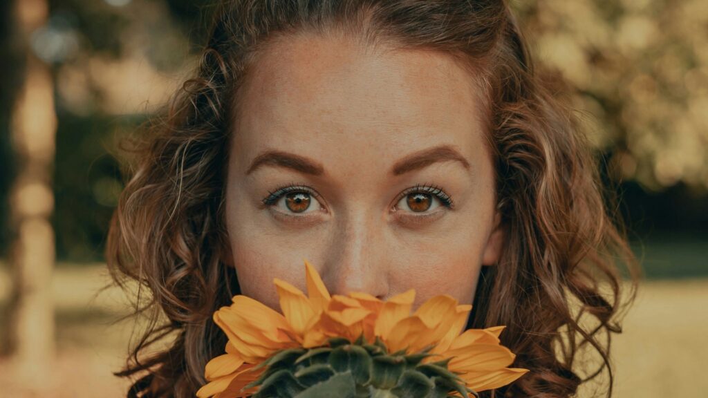 Woman Smelling Flower